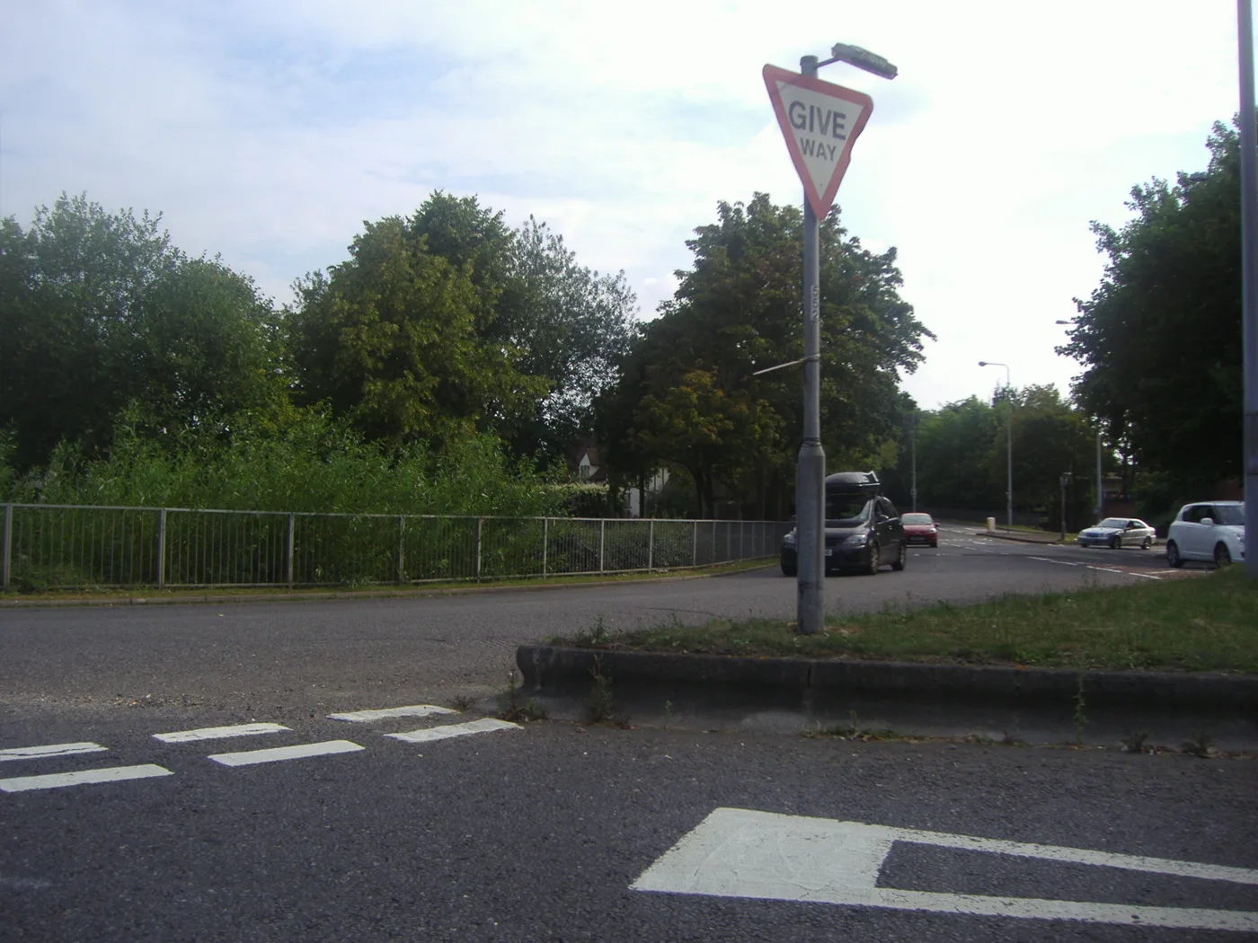 Hitchin Road at the roundabout on the edge of the Old Town, about 100m south of the four houses.