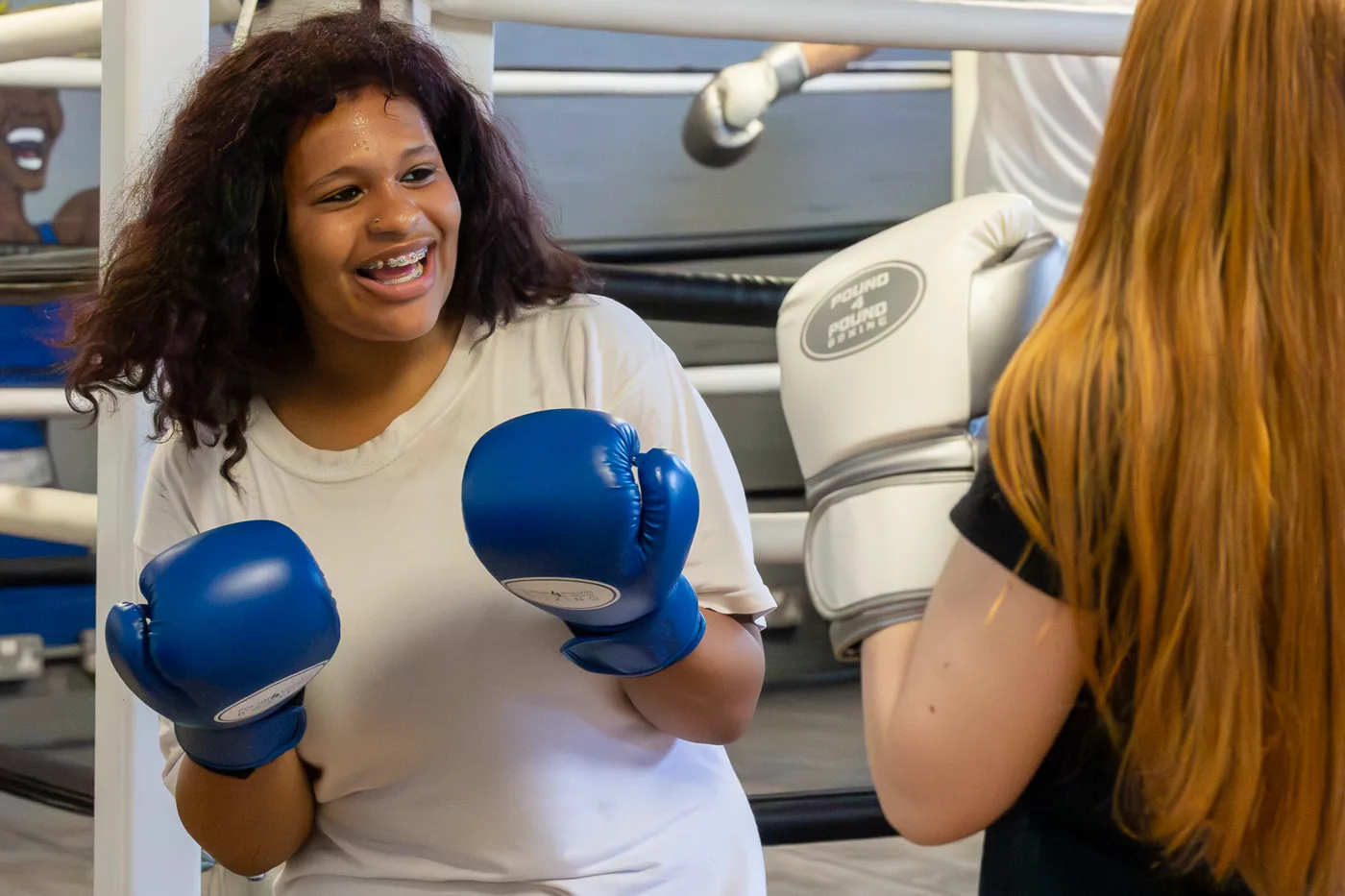 A young girl boxing with Growing Resilience in Teens (GRIT)