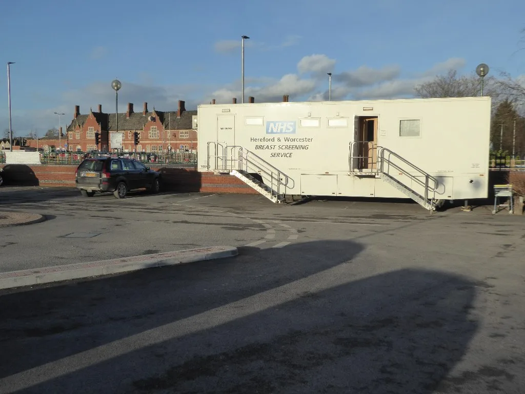A mobile NHS breast screening unit in a car park, the same kind of unit now on Hitchin Road (this one is in Hereford)
